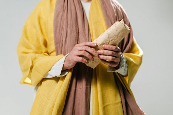 Ancient scrolls and symbols representing the wisdom of yoga.